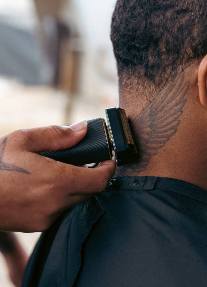 Compton Cowboys man shaving neck with reSurge shaver