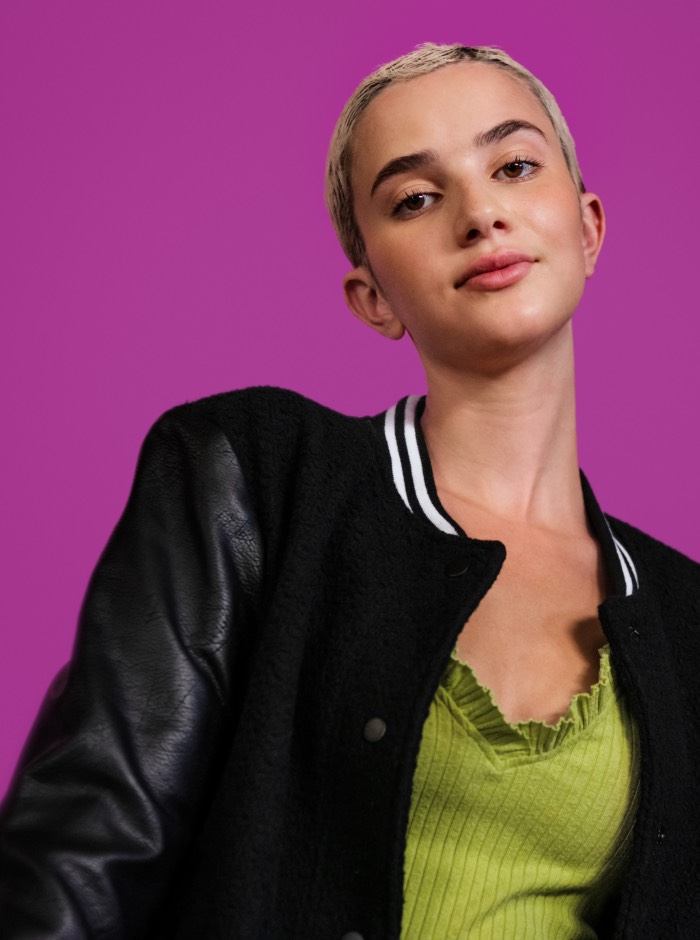 Large image of girl with short hair on pink background